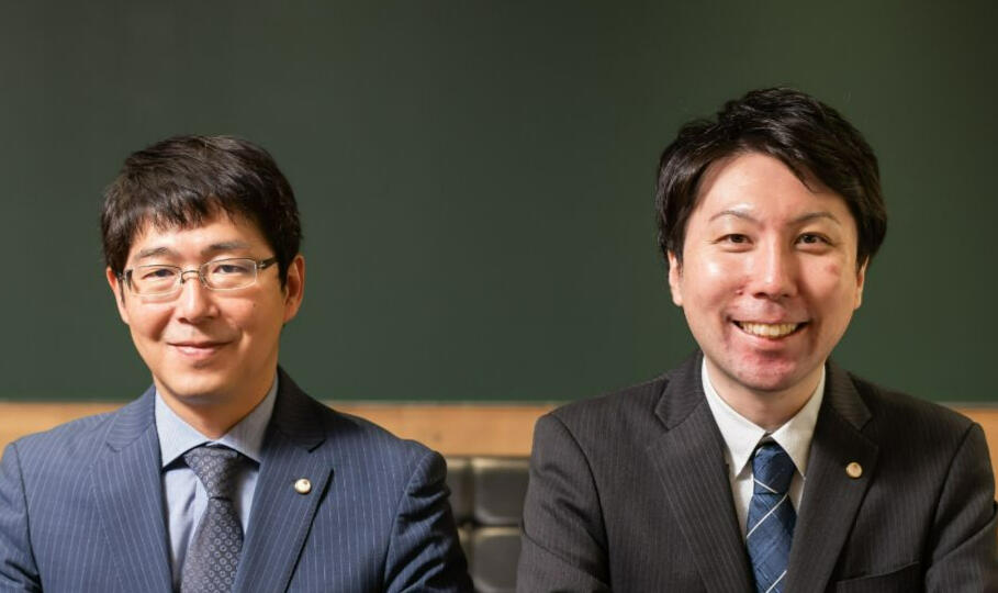 Two male Japanese accountants in Sapporo wearing suits